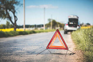 A warning triangle on the road.
