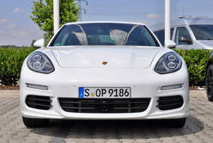 A parked white Porsche